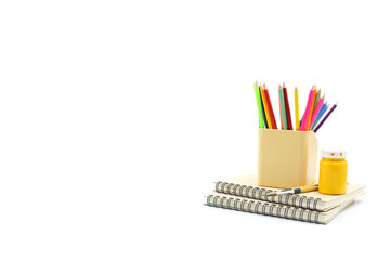 Stationery set background - Brown spiral notebook and color pencils