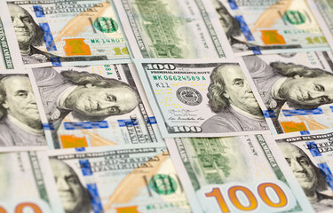 One Hundred Dollar Banknotes are creatively laid out. Money banknotes of US dollars, a lot of different money. Buy printing, banking. Cash income, wealth and financial independence.