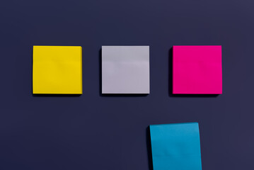 Colorful sticky notes isolated on purple background. Sticky notes background. Empty copy space blank paper