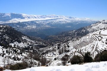 Amazing  view and landscape of Qartaba's Mountain in Lebanon covered with snow passing by a river...