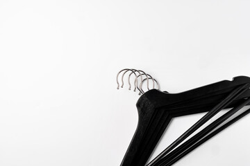 a pile clothes hangers on isolated white background