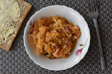 Bigos in a bowl with bread