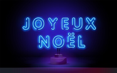 French Christmas red neon light sign on a dark background. Joyeux Noel translation: Merry Christmas.