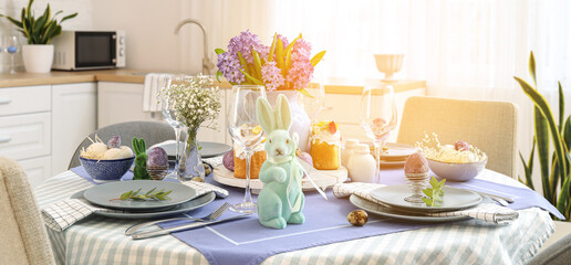 Beautiful table setting for Easter celebration in kitchen
