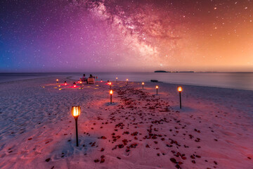 Amazing beach dinner setting under Milky Ways night sky. Luxury destination dining, honeymoon or anniversary dinner, flowers and candles for the best romantic experience. Stunning colorful outdoors - Powered by Adobe