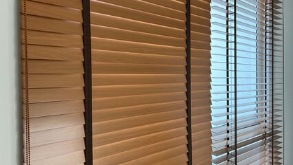 Wooden blinds for interior use on window of house - obrazy, fototapety, plakaty