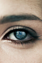 woman eye with a pentacle inside her eye