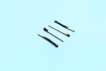 Burnt wooden matches on color background, Concept of work burnout