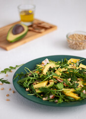 Salad with smoked chicken, mango, and avocado.