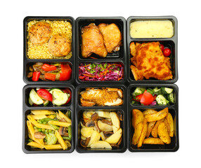 Different delicious food in lunch boxes on white background