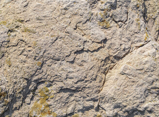 Soild stone texture background. Front view yellow rock