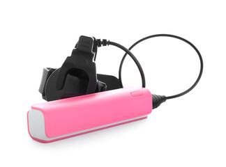 Pink power bank with smartwatch on white background