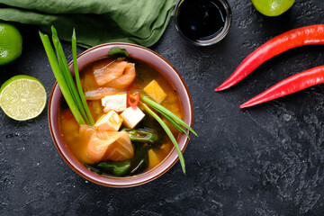 Asian fish soup on a black background