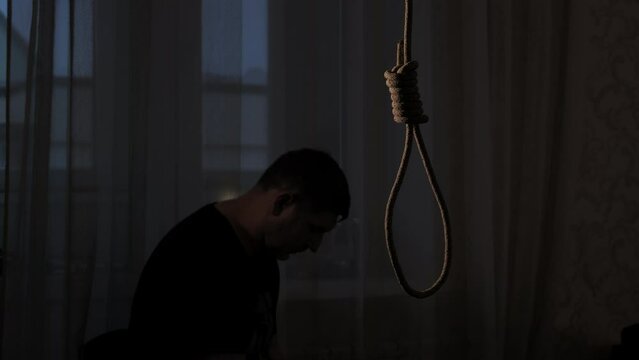 Depressed man contemplating suicide