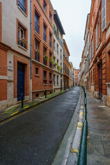 Fototapeta na wymiar Empty old street in Toulouse old city