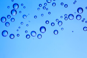 Clear water with air bubbles on blue background