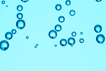 Clear water with air bubbles on blue background