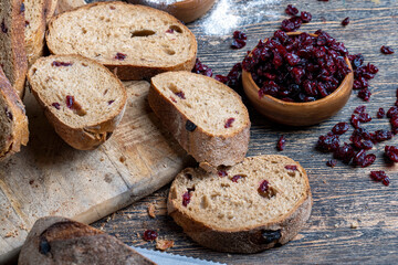 fresh cut bread made of flour and dried cranberries