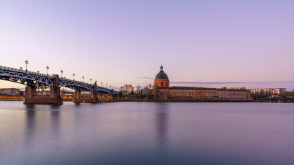 Garonne river and Dome of the 'Hopital de la Grave' at dusk in Toulouse, France
