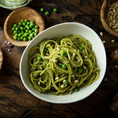 Spaghetti with pesto sauce and green pea
