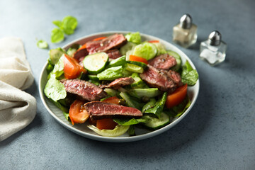 Fresh vegetable salad with beef steak