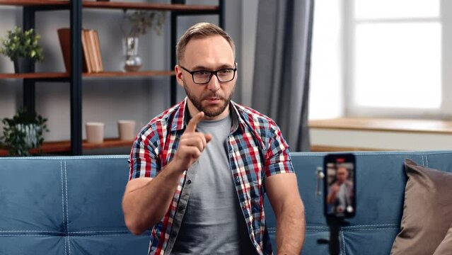 Male online mentor coach shooting online video streaming use smartphone talking consulting advice