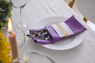 Dining table with beautiful setting and blank card