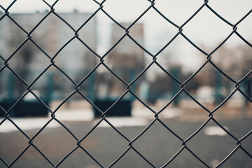 Netting mesh against blurred city background