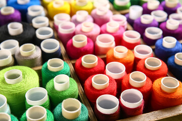 Closeup view of boxes with different sewing threads