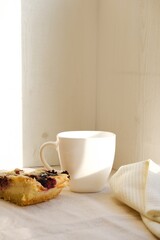Homemade pie with cheese and berries. Cheesecake. Cozy breakfast. Empty space. Neutral modern simple minimalistic food template. Handmade traditional sweet plant-based organic bakery.