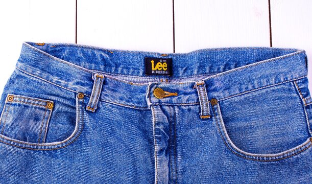 Close up of the Lee button on the blue jeans