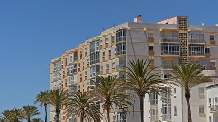 Fototapeta na wymiar Modern apartment buildings in pastel colors in Cadiz, Andalusia, Spain