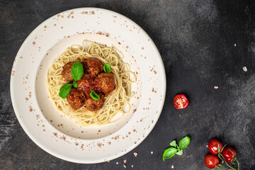 Meatballs served over italian spaghetti pasta with tomato sauce. Italian food. banner, menu, recipe...