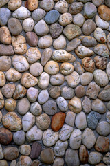Opposite the coloured pebbles