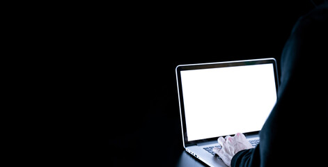 Cyber hacker attack concept. Internet web hack technology. Digital laptop in hacker man hand isolated on black. Information security terms cybersecurity banner.