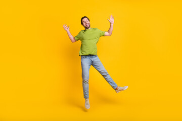 Fototapeta na wymiar Full length photo of young man good mood jumper wear casual clothes isolated over yellow color background