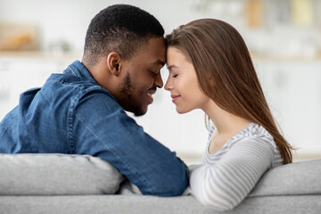 Romantic Moment. Loving Interracial Couple Bonding Together At Home, Closeup Shot