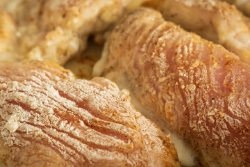 frying raw chicken breast fillet flour covered closeup