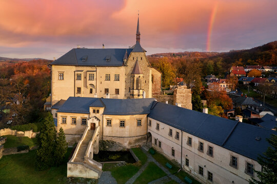 Renaissance castle Sternberk in the middle of autumn nature with rainbow in background. Olomouc region, Moravia, Czech republic.