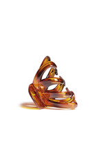 Subject shot of an amber colored hair clip with curly claws. The hair clip is isolated on the white background. Vogue accessory for ladies and girls.