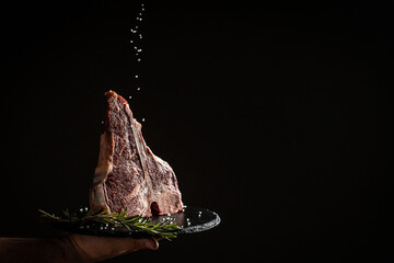 The T-bone or porterhouse steak of beef cut from the short loin. steak include T-shaped bone with...