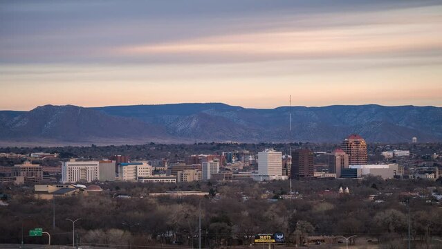 Sunset Timelapse of Albuquerque New Mexico skyline with mountains behind, 4K