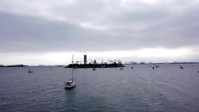 An amazing aerial drone shot, drone flying fast and low towards Thums Island in Long Beach, California.