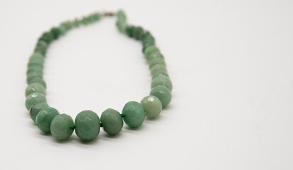 green beads on a white background