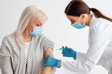 Senior Patient Receiving Coronavirus Vaccine Intramuscular Injection