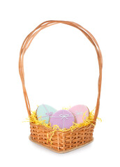 Fototapeta na wymiar Wicker basket with Easter cookies in shape of eggs on light background