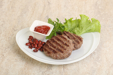 Grilled beef burger cutlet with sauce