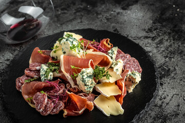 Appetizers. Sandwich with prosciutto and blue cheese. antipasti with red wine. banner, menu recipe...