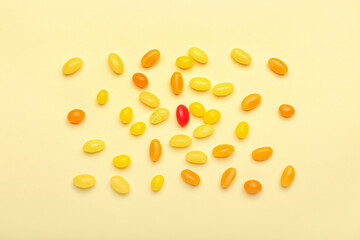 Different jelly beans on beige background