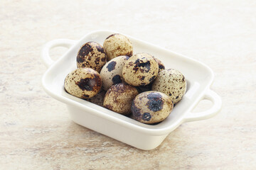 Raw quail eggs heap in the bowl